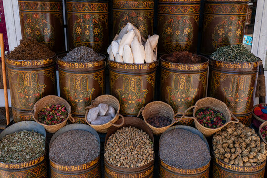 Spices and herbs displayed in baskets at a market in Marrakech