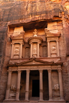 Visitors stand in awe of Al-Khazneh, a historical site carved into rock in Petra