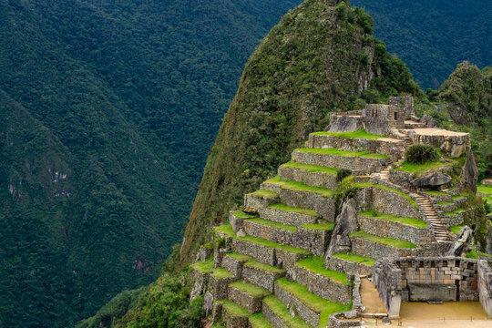 Exploration of Inca architecture at Machu Picchu reveals terraces and stone structures in the Andes mountains of Peru