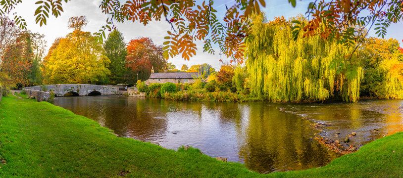 View of Sheepwash Bridge over the River Wye with autumn colors in Bakewell, Derbyshire Dales, England
