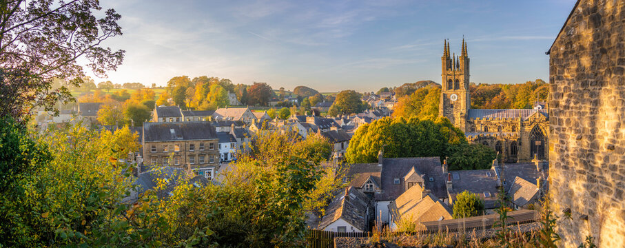 Autumn view of St John the Baptist Church in Tideswell with surrounding landscape in Derbyshire Peak District, England