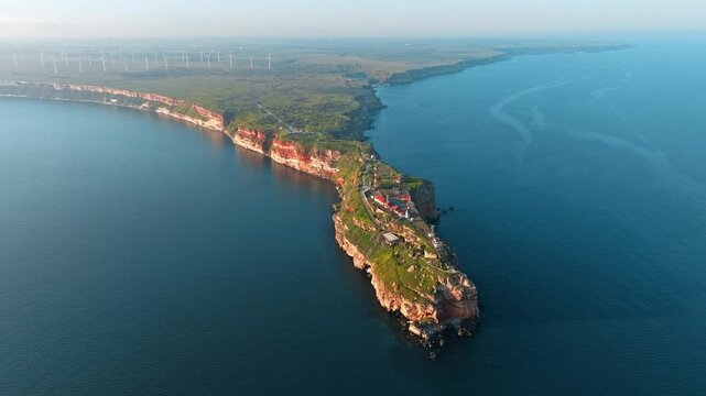 Cape Kaliakra Bulgaria Aerial Drone High Angle Black Sea Peninsula Red Cliffs Wind Turbines Golden Hour Sunset Spring Travel Tourism Nature Landmark Geography Concept Horizontal Video