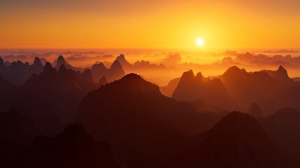 Obraz premium Realistic mountain sunrise landscape with textured highland peaks, amber sunlight and cool fog in distant valleys, grand and peaceful atmosphere