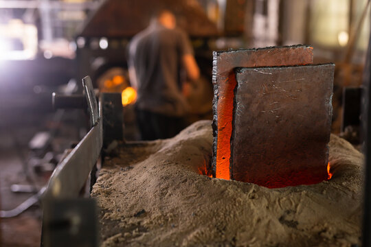 Ferrous metal billet is melted in an induction furnace closeup