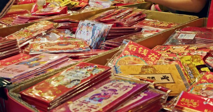 Taipei, Taiwan, February 4, 2026: Customers select colorful red envelopes on Dihua Street on the eve of the Lunar New Year.