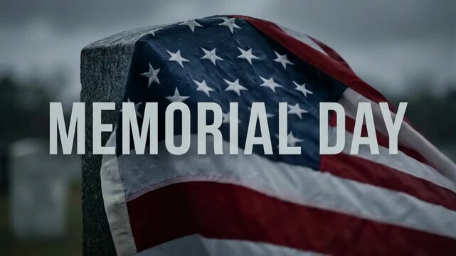 American flag draped over a gravestone on Memorial Day. National tribute for soldiers in a cemetery. Patriotic remembrance for a fallen military veteran hero.