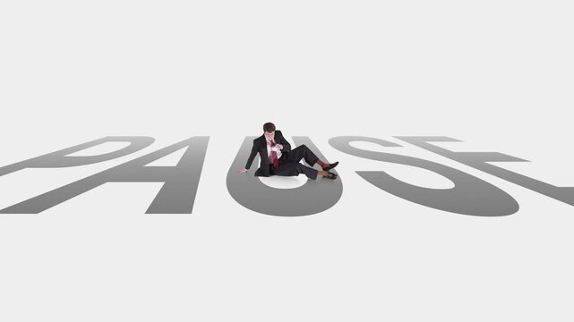 Small businessman sitting on pause word with cup of coffee in stop motion animation. Concept of work break, delayed decision, project hold, waiting period and business slowdown.