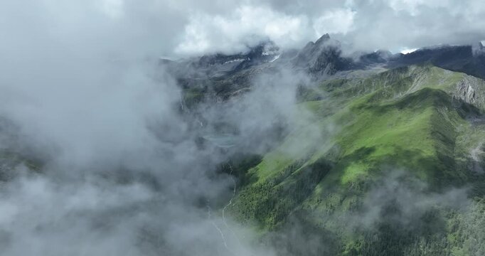 Aerial view of beautiful high altitude lake and snow capped mountain landscape