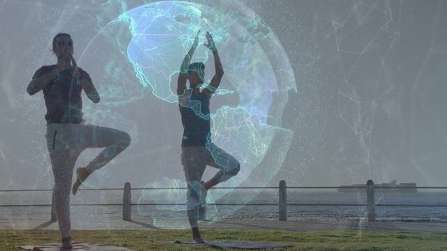 Two men starting arms raised, shifting into tree pose for fitness digital globe overlaying behind