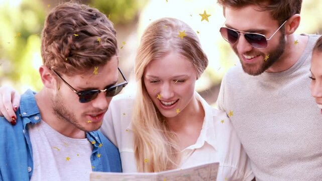 Friends unfolding map and pointing, planning travel in park while star confetti floats across frame