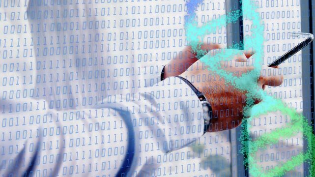 Businessman holding device by window, tapping screen, sparking binary strand overlay, checking data