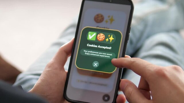POV of a user agreeing to cookie storage on a mobile app. The green consent banner features a cookie icon and confirmation message. Great for illustrating digital trust, transparency, and secure