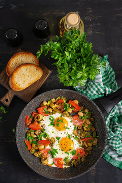 Healthy Breakfast with Fried Eggs and Vegetables in Frying Pan, Top view
