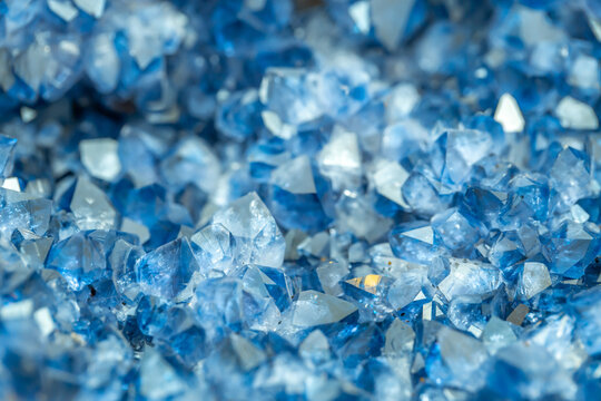 Blue Crystal Mineral Stone. Gems. Mineral crystals in the natural environment. Texture of precious and semiprecious stones. Seamless background with copy space colored shiny surface of precious stones