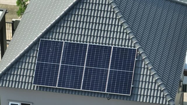 Drone view of rooftop solar installation, showcasing solar energy efficiency, eco-friendly power production, reduced fossil fuel dependency and long-term sustainability benefits for modern households.