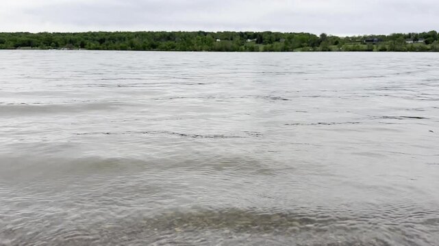 Waves Gently Landing on a Lake Shore