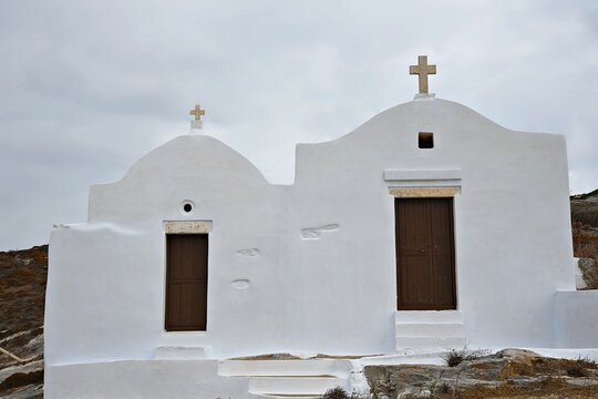 Landscape with scenic view of the Treis Paides and Aghios Athanassios  two picturesque Greek Orthodox chapels in Amorgos island, Cyclades Greece.