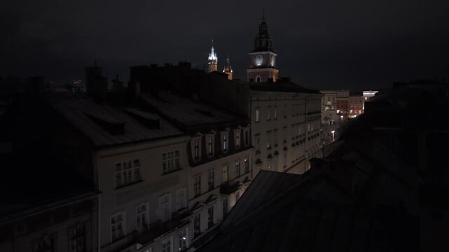 Aerial flyover of central Krakow in the winter evening