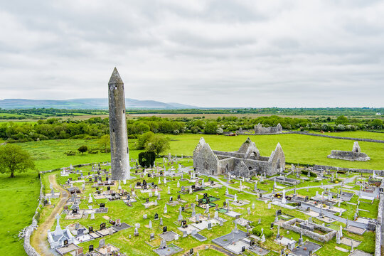 Aerial view of Kilmacduagh Abbey and cemetery near Gort, County Galway, Ireland. Historic monastic site and round tower in the Kiltartan landscape of south Galway.