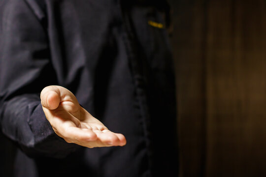 Man's open hand reaching out. Hand Gesture. Human Reaching. Business Concept. Giving and Receiving Hand Gesture. High quality photo