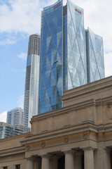 Fototapeta premium contrast of historic Union Station and CIBC Square, designed by WilkinsonEyre + Adamson Associates, headquarters of Canadian Imperial Bank of Commerce, looking southeast from Front St W, Toronto