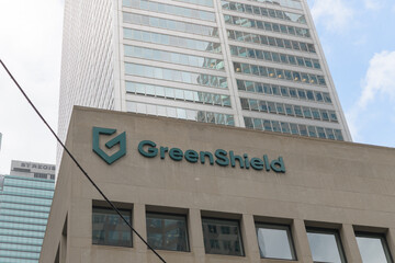 Fototapeta premium exterior building facade and sign of GreenShield, a major Canadian health and benefits organization, located at Commerce Court South, 30 Wellington St W, Toronto