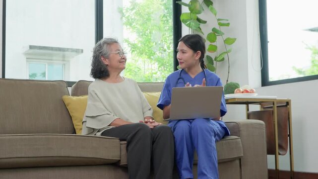 Caring Hands: A compassionate caregiver consults with a senior, fostering trust and providing support, as they sit side by side on a comfortable sofa, their bond highlighting the essence of care.