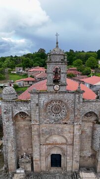 Approaching the medieval stone bell tower of Santa Marina de Augas Santas