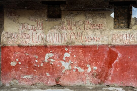 Pompeii, Italy 8. March 2026, Ancient Roman graffiti on a ruined wall in Pompeii, Italy