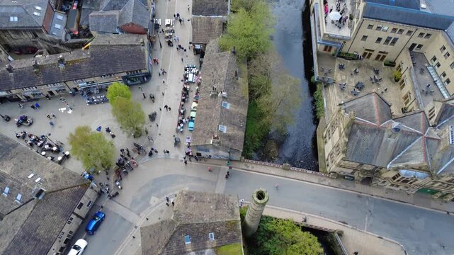 aerial drone view of Hebden Bridge town Centre in spring showing the bridge and Colden Water