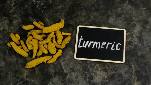 Turmeric root for supplements and essential oils. Selective focus.