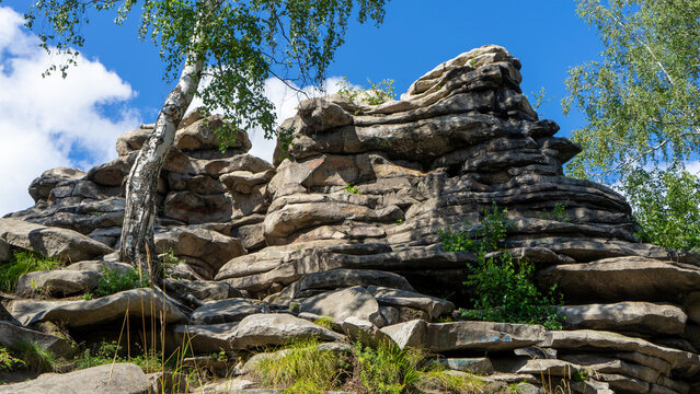 Devil's Hillfort complex on sunny summer day. Iset Park, Iset village, Sverdlovsk region, Russia. Hiking and walking