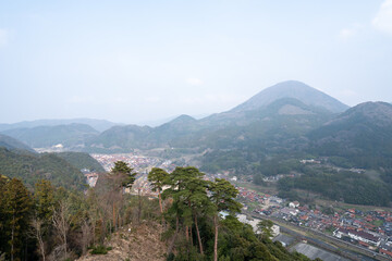 Fototapeta premium Hazy Panoramic View of Tsuwano Town and Valley from Tsuwano Castle Ruins, Shimane