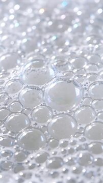 White foamy soap bubbles used for hygiene products or cleaning service advertisement