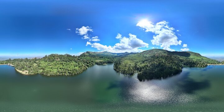 360 aerial photo taken with drone of Mulunguzi Dam in the late morning on the Zomba Plateau overlooking the town below in Malawi