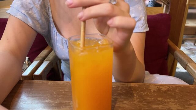 Tropical Fruit Juice with Cocktail Stirrer in Phuket Cafe