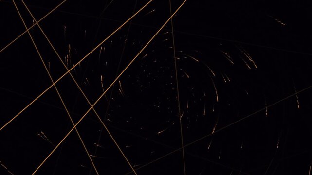 Golden particle spiral spinning in dark space motion graphics background