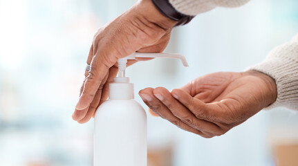 Obraz premium Person, hands or sanitizer with dispenser in clinic for disinfection, bacteria or germ removal. Closeup, patient or hygiene with bottle or container for healthcare safety, security or protection