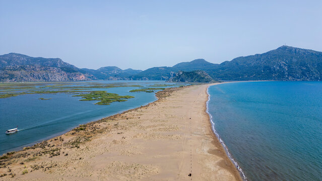 Iztuzu Beach, Turkey - May 9, 2026: Aerial drone view of Iztuzu Beach near Dalyan, Muğla Province, Turkey, showing the sandy coastline, turquoise Mediterranean Sea, Dalyan river