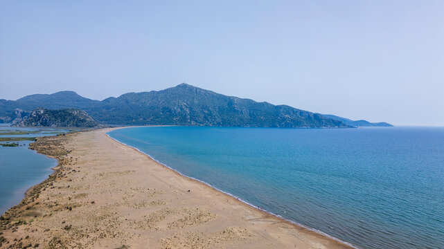 Iztuzu Beach, Turkey - May 9, 2026: Aerial drone view of Iztuzu Beach near Dalyan, Muğla Province, Turkey, showing the sandy coastline, turquoise Mediterranean Sea, Dalyan river
