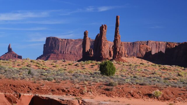 The iconic red sandstone formations of Monument Valley, located on the Navajo Nation land extending from northern Arizona into Utah.