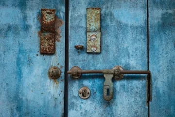 Fototapeten Zauberwald Close up photo of old wooden door with a door latch  © Elena_Alex
