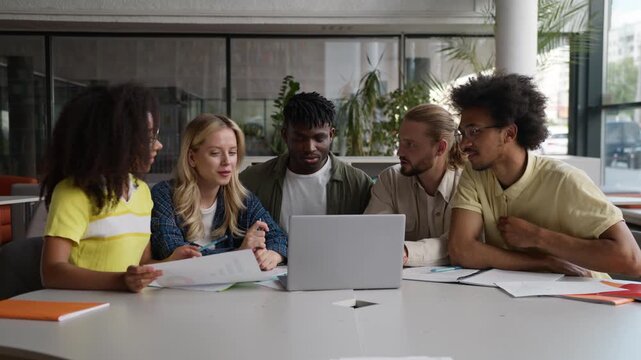 Five multiethnic diversity students friends classmates studying with laptop online computer study learn talking discuss exam test learning in university college academy preparing for course e-learning