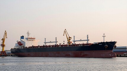 Fototapeta premium Idle Supertankers Docked in Quiet Port