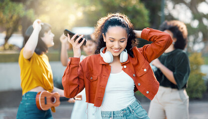 Dance, music and woman with friends for outdoor fun, celebration and happy for phone playlist. Listening, audio and people with song, happiness and streaming for gathering, bonding and group hangout