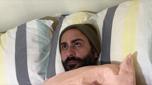 Man Lying in Bed Grappling with Borderline Personality Disorder, Bipolar Coping Challenges, Deep Depression, Anxiety, Loneliness and Inner Emotional Conflict