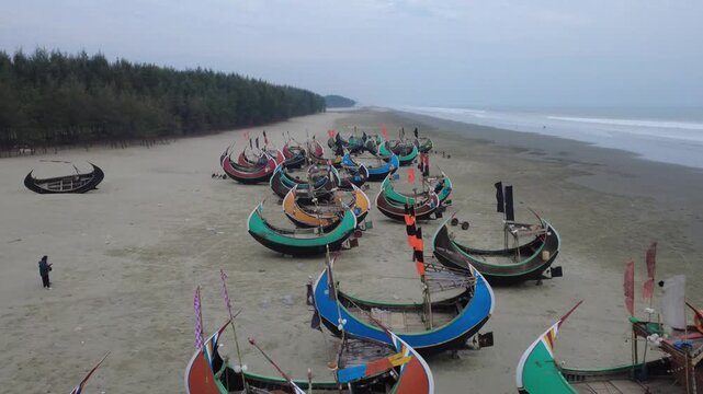 Traditional Wooden Fishermen's fishing boat, Teknaf Coxs bazar, Bangladesh. Colorful Wooden Fishing Boat On a Cox's Bazar Sea Beach With Blue Background in Bangladesh 