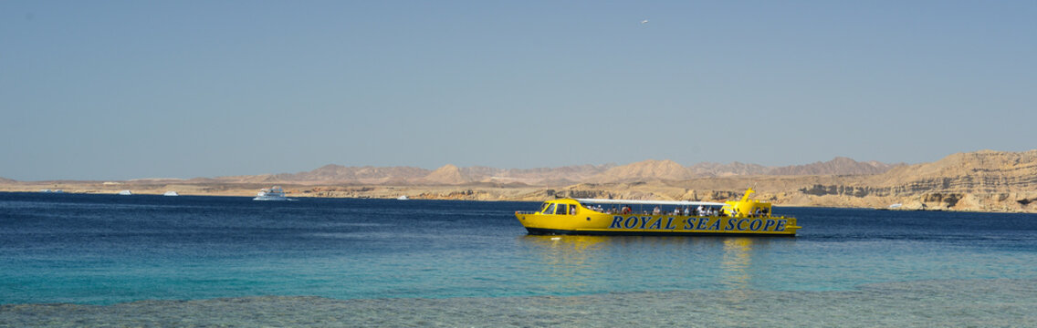 Sharm El Sheikh, Egypt - March 12, 2025: bathyscaphe pleasure boat with tourists on an excursion in the Red Sea.
