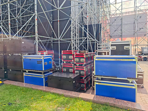 Outdoor concert stage setup with metal scaffolding