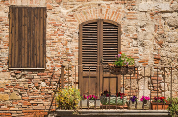 Fototapeta premium Italian window and door details of medieval house in Chianti, Tuscany, Italy